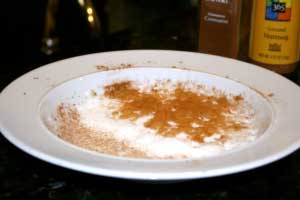 Whipped milk on shallow plate with powders Whipped milk on shallow plate with powders
